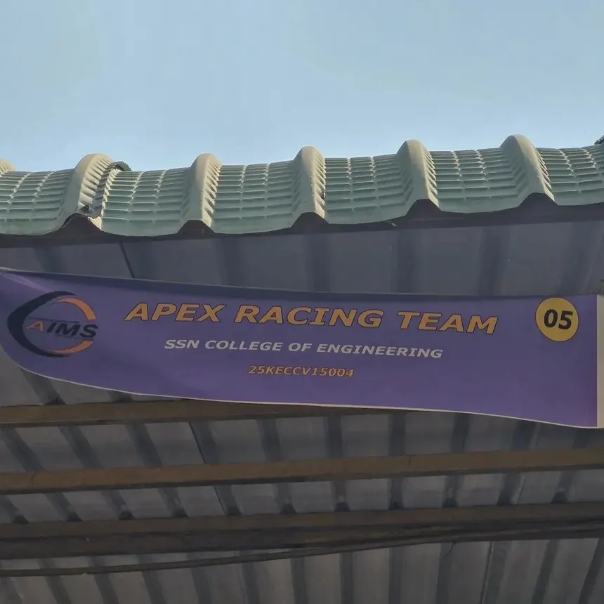The Apex Racing Team banner hung over the pit garage at FKDC 2025.