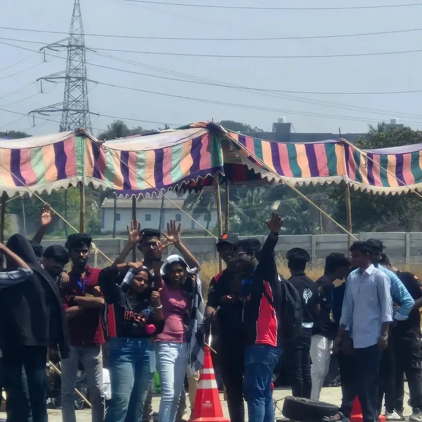 Teams and spectators packed under the paddock awnings at FKDC.