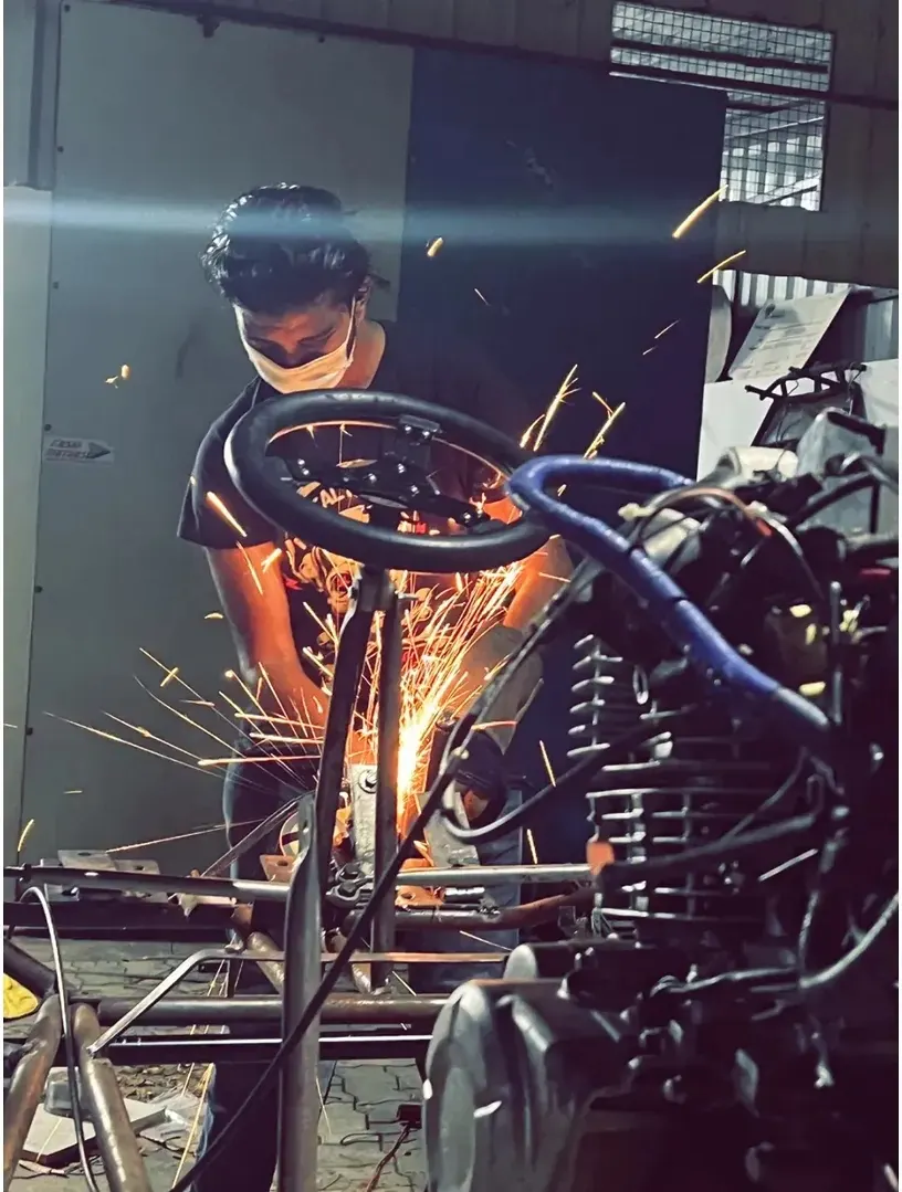 Welding sparks around the steering column during a build session.